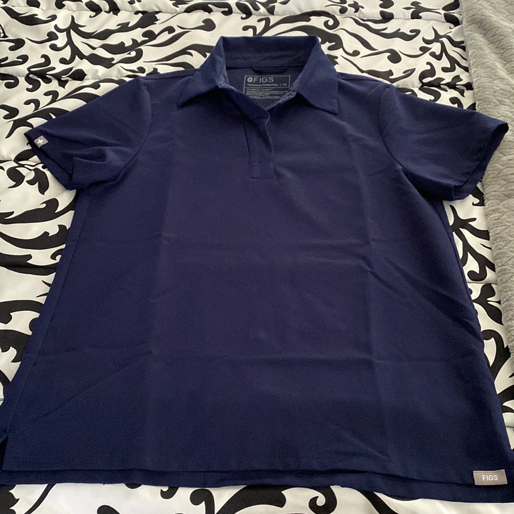 Didn’t wear many times. This is a navy blue scrub top with a collar!